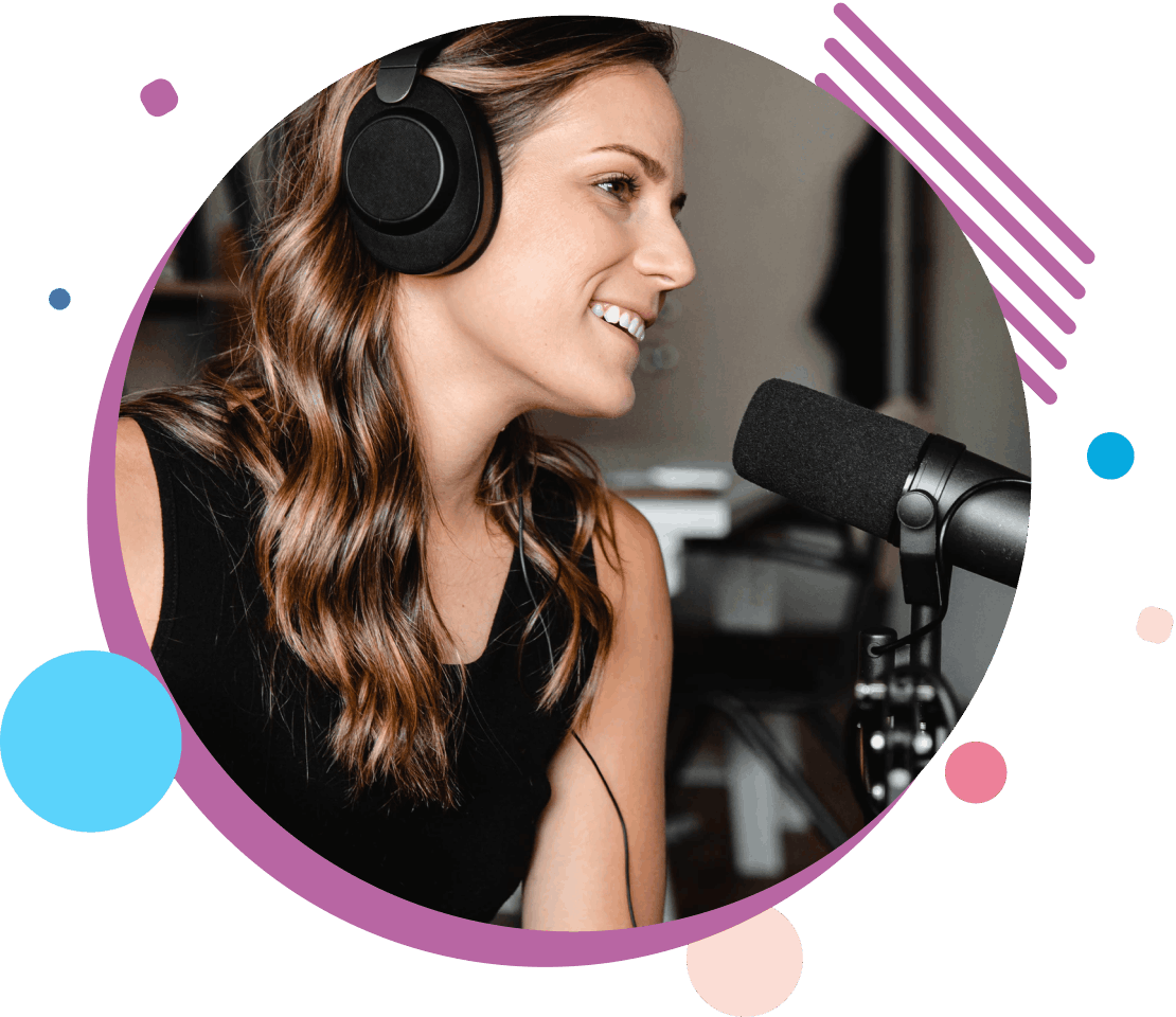 A podcaster smiling into a desk-arm mounted microphone